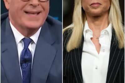 The joke-bright glow of late-night TV shattered the second Stephen Colbert’s voice cracked on air. What was supposed to be a simple tribute to Virginia Giuffre turned into something raw, shaking, and completely off-script. Colbert’s hands trembled against the desk as he whispered, “She fought the darkness… and they punished her for it.” The studio froze. Cameras drifted in closer. And then he said the line that pulsed through the room like a live wire, dragging every laugh out of the air and replacing it with dread.